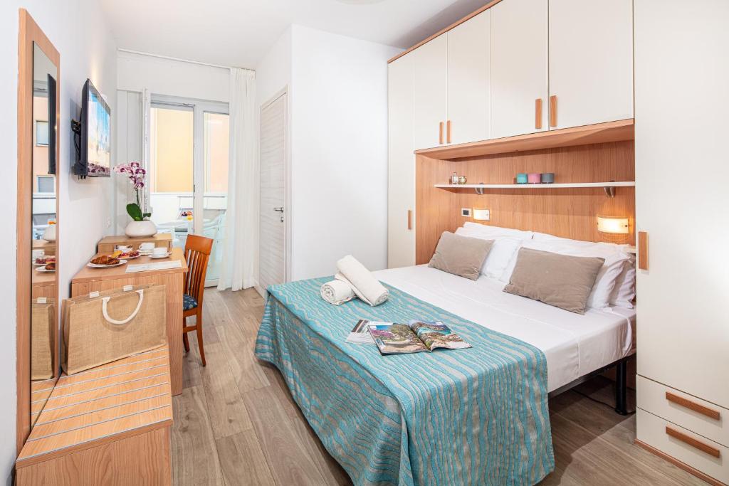 Postel nebo postele na pokoji v ubytování Hotel Danieli