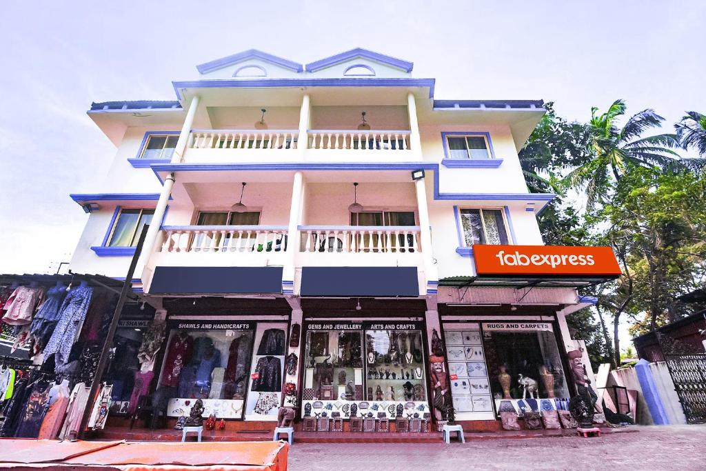 a store front of a building with a balcony at FabHotel Grand Royal Palms in Benaulim