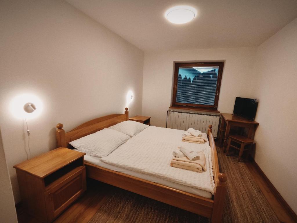 Postel nebo postele na pokoji v ubytování Rooms and Apartments Panker