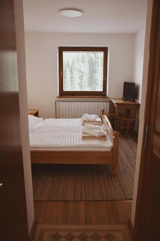 Postel nebo postele na pokoji v ubytování Rooms and Apartments Panker