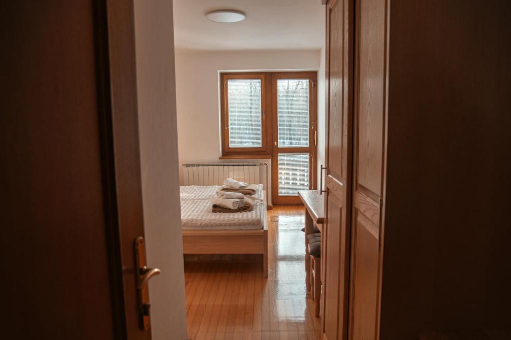 Postel nebo postele na pokoji v ubytování Rooms and Apartments Panker
