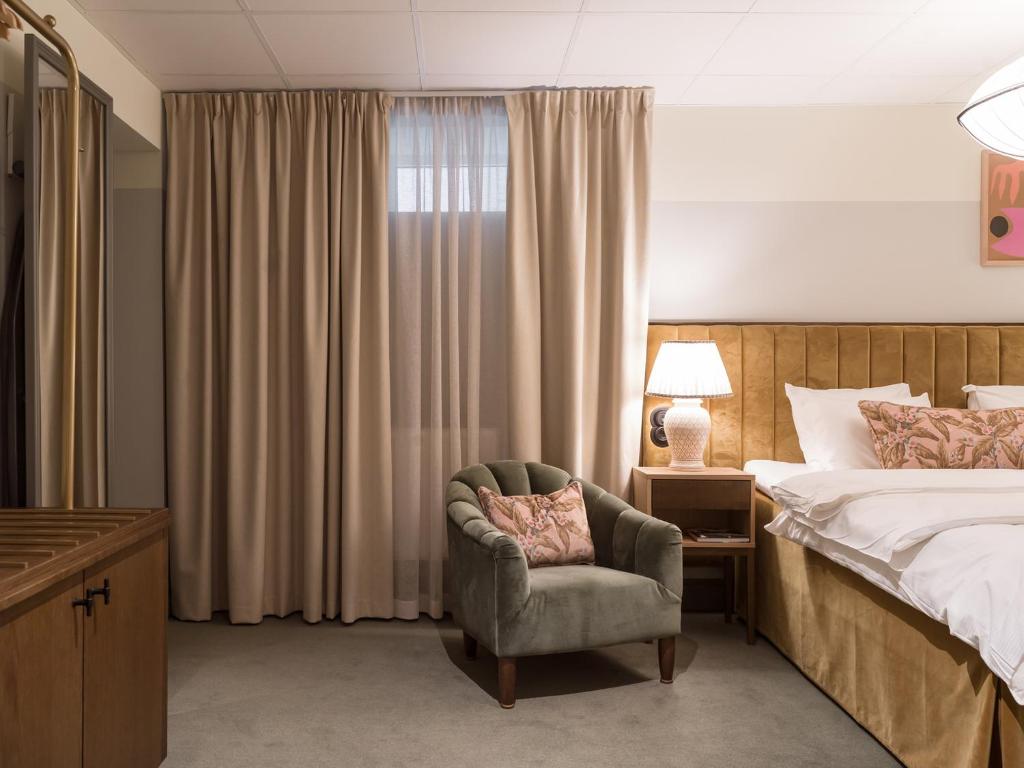 Postel nebo postele na pokoji v ubytování Elite Hotel Mårtenson