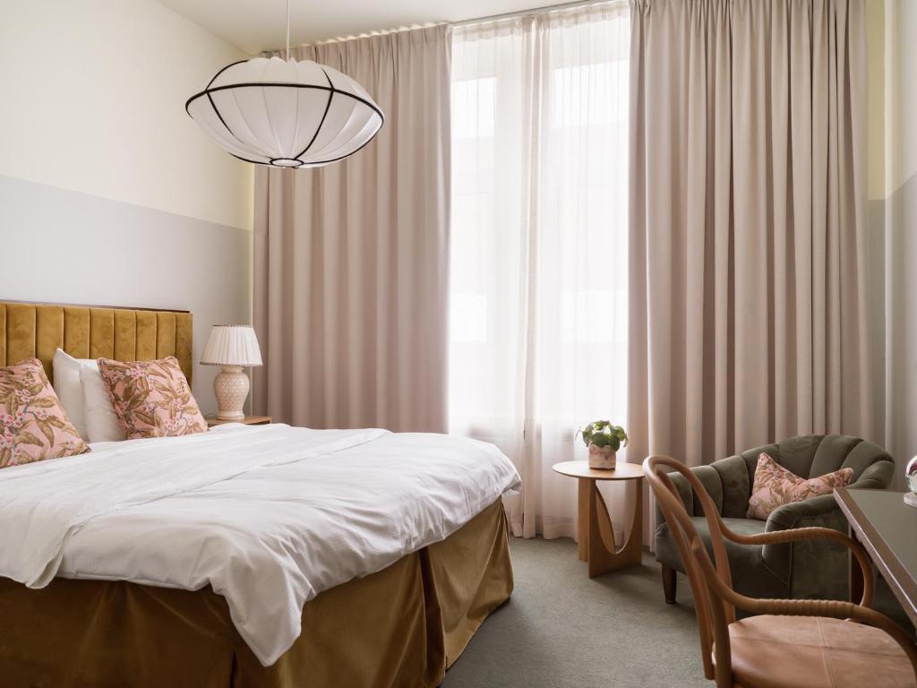 Postel nebo postele na pokoji v ubytování Elite Hotel Mårtenson