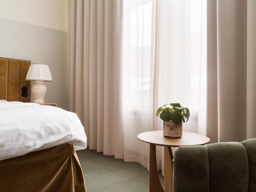 Postel nebo postele na pokoji v ubytování Elite Hotel Mårtenson