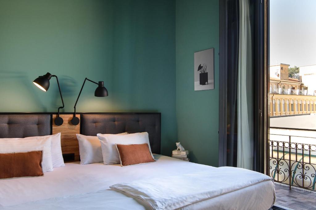 Letto o letti in una camera di The Poet Hotel