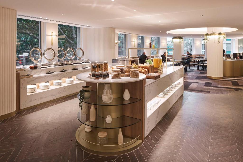 a store with a dessert counter in a building at Rydges Darling Square Apartment Hotel in Sydney