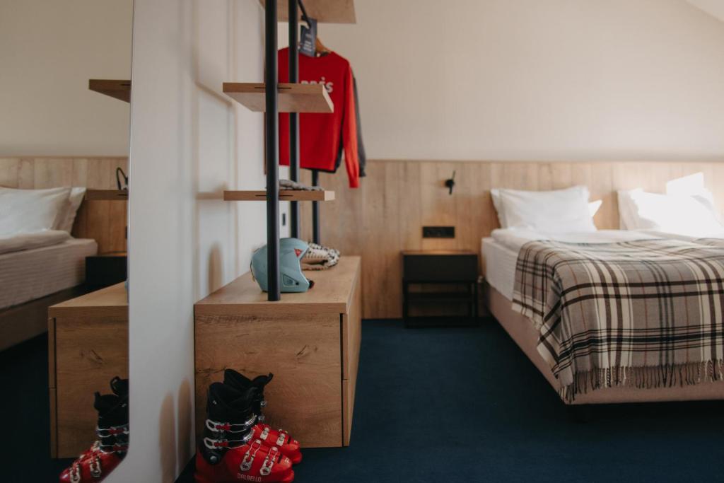 Postel nebo postele na pokoji v ubytování Alpina Hotel