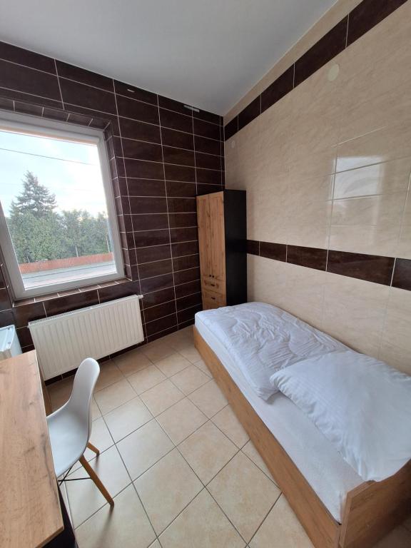 Postel nebo postele na pokoji v ubytování Noclegi MaxTrans