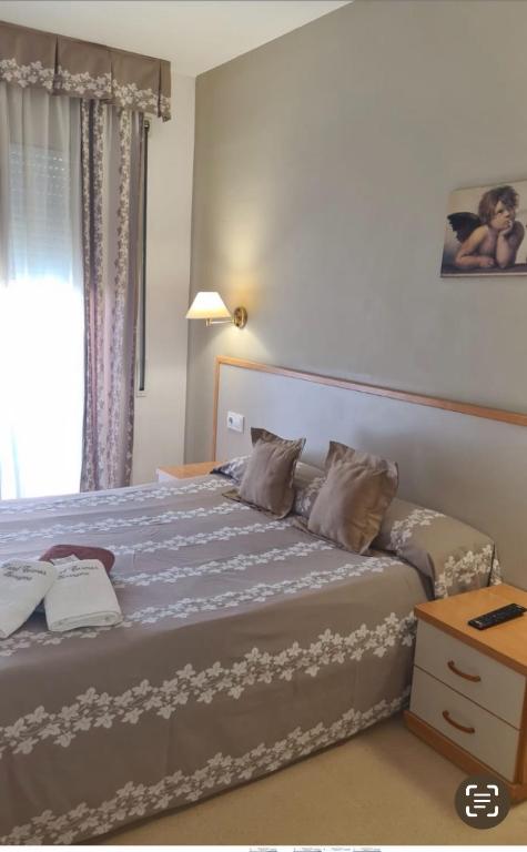 Postel nebo postele na pokoji v ubytování Hotel Cosmos Tarragona