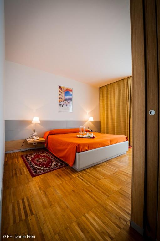 Postel nebo postele na pokoji v ubytování Schio Hotel