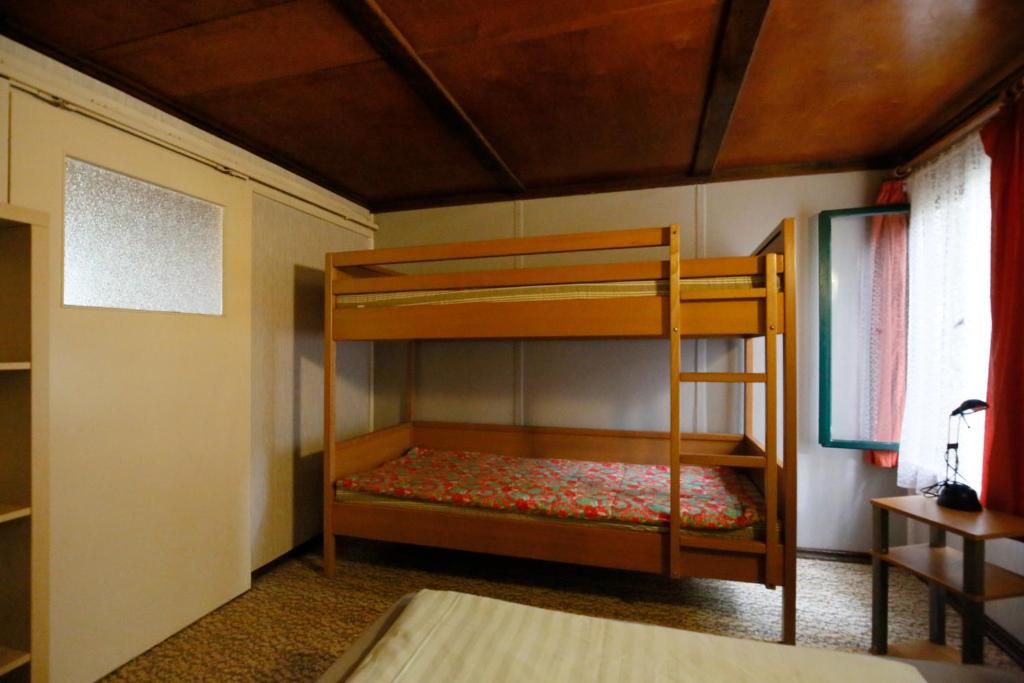 Postel nebo postele na pokoji v ubytování Bungalow MEER ODER WENIGER direkt am Strand