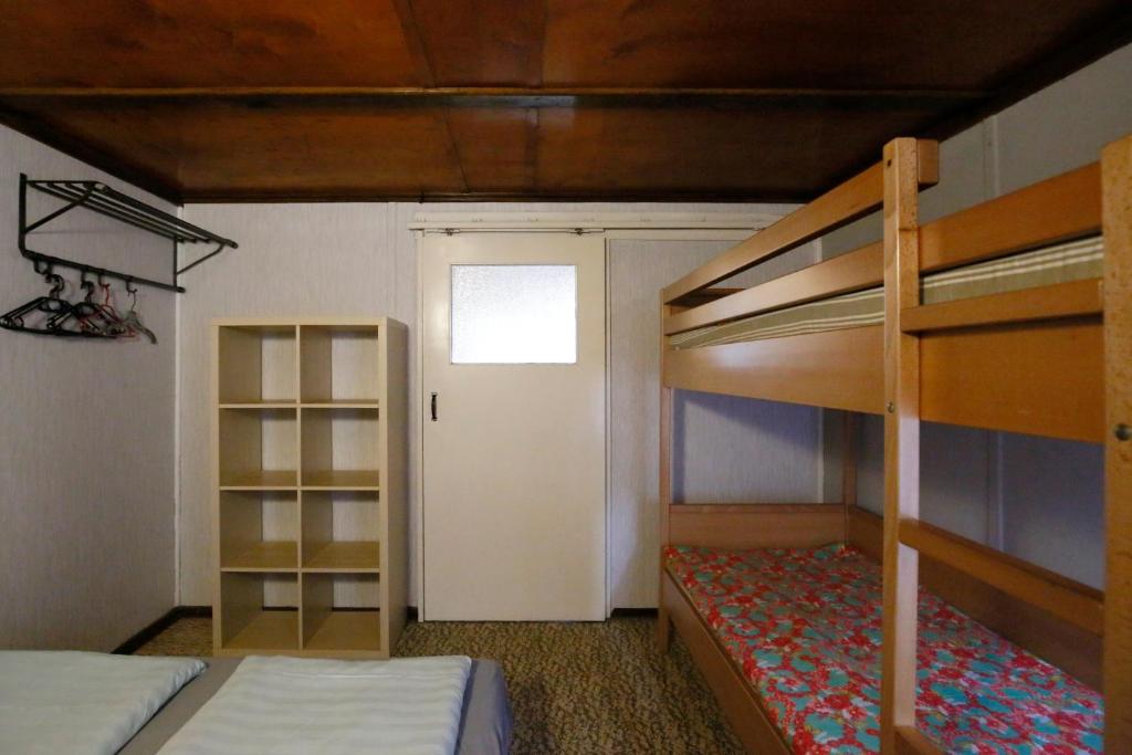 Postel nebo postele na pokoji v ubytování Bungalow MEER ODER WENIGER direkt am Strand