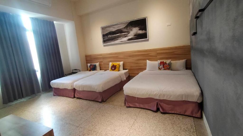 Postel nebo postele na pokoji v ubytování Rainbow Hotel