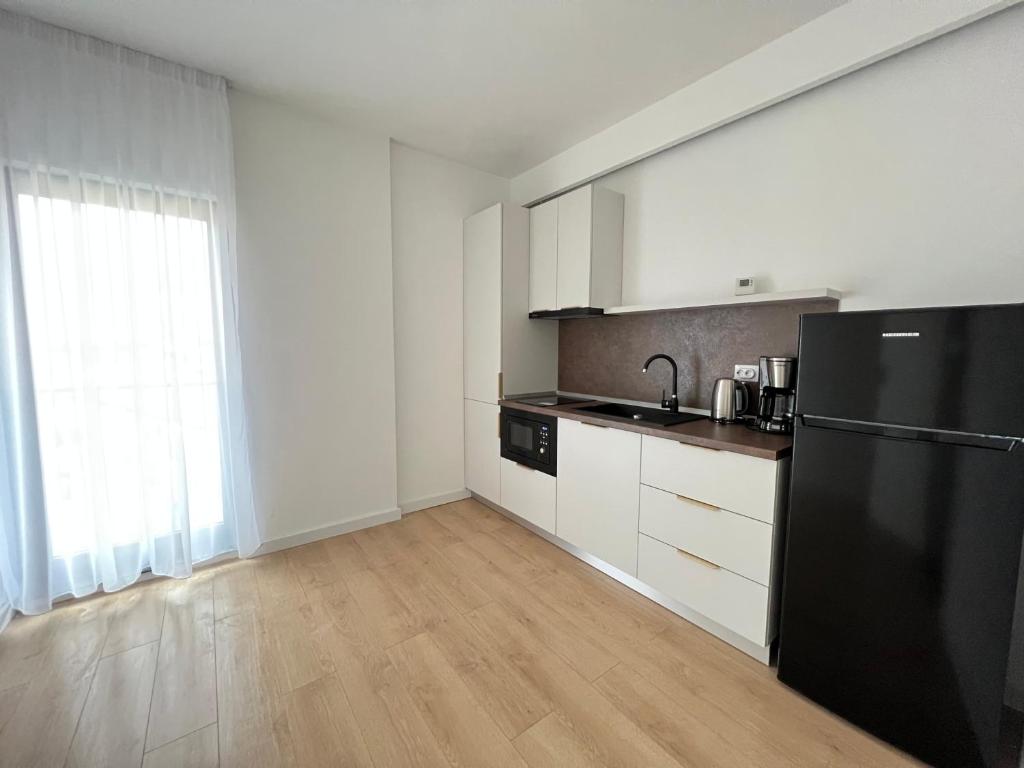 Kuchyň nebo kuchyňský kout v ubytování Exit Aparthotel