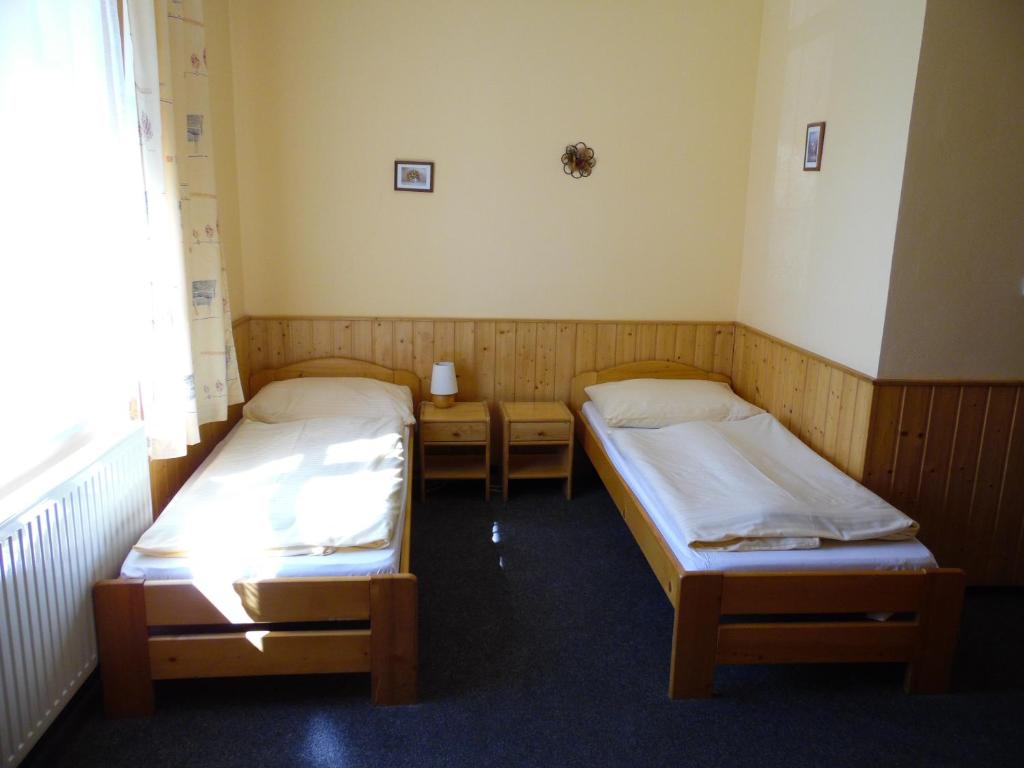 Postel nebo postele na pokoji v ubytování Penzion Velke Darko