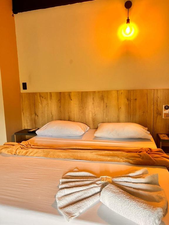 Postel nebo postele na pokoji v ubytování Seven hotel