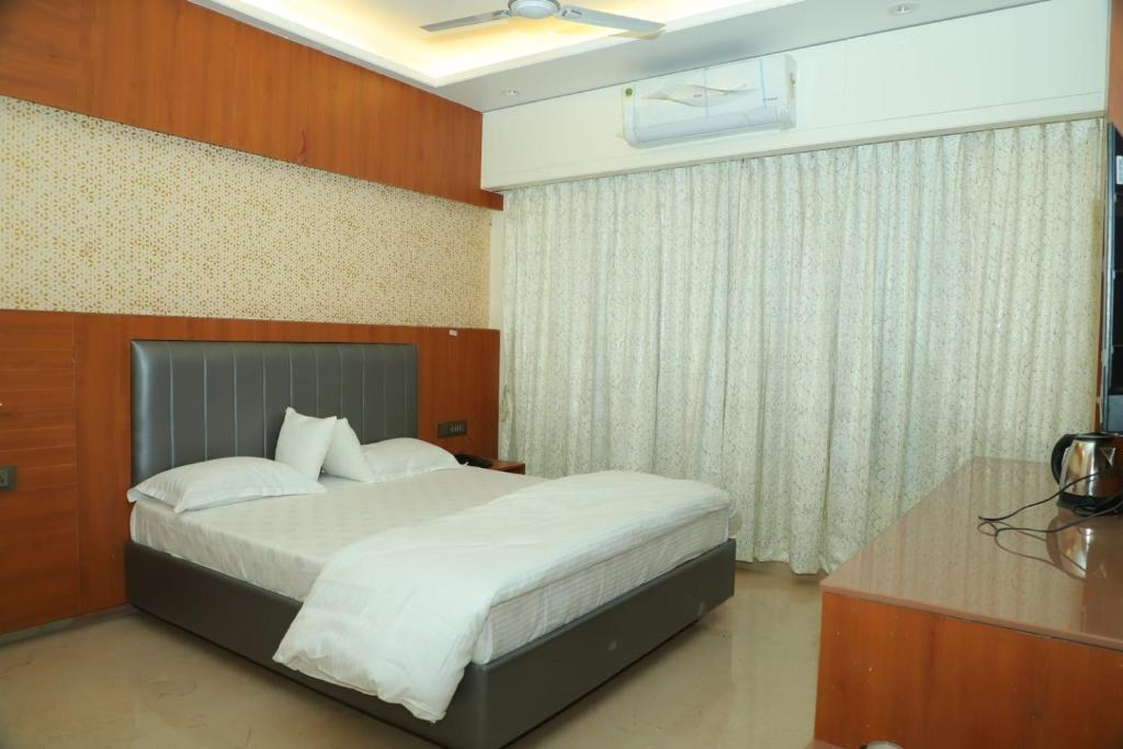 Postel nebo postele na pokoji v ubytování Hotel Sai D-lax