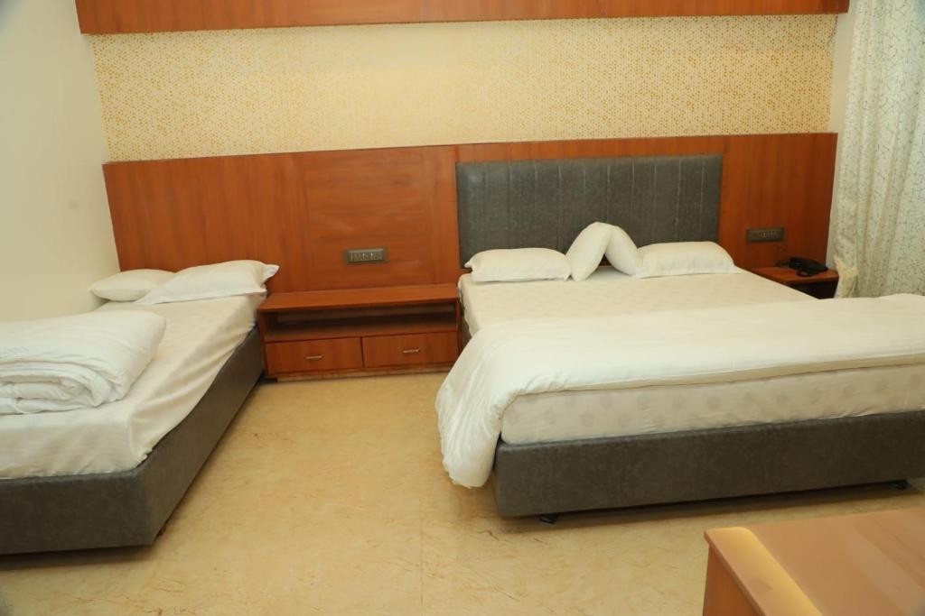 Postel nebo postele na pokoji v ubytování Hotel Sai D-lax