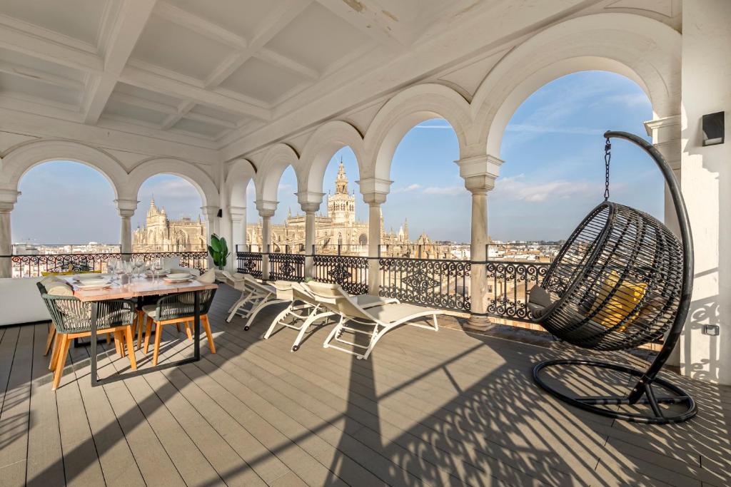 A balcony or terrace at ISG Apartments The most Exclusive apartment in Sevillaparking
