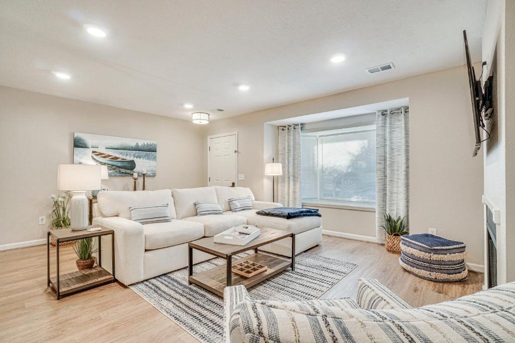 a living room with a couch and a table at Bright Helen Cottage Walk to Town! in Helen