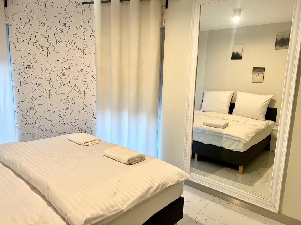 Posteľ alebo postele v izbe v ubytovaní Zielone Apartamenty Katowice Chorzów
