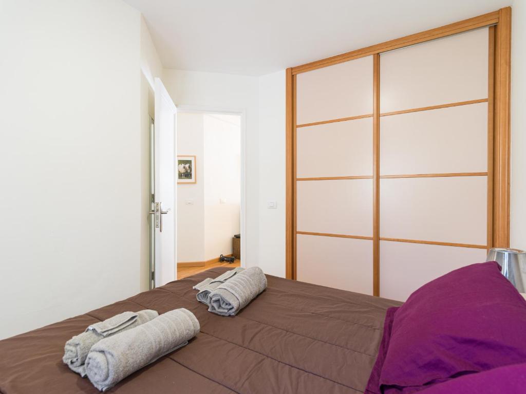 A bed or beds in a room at Lovely Peaceful Home By CanariasGetaway