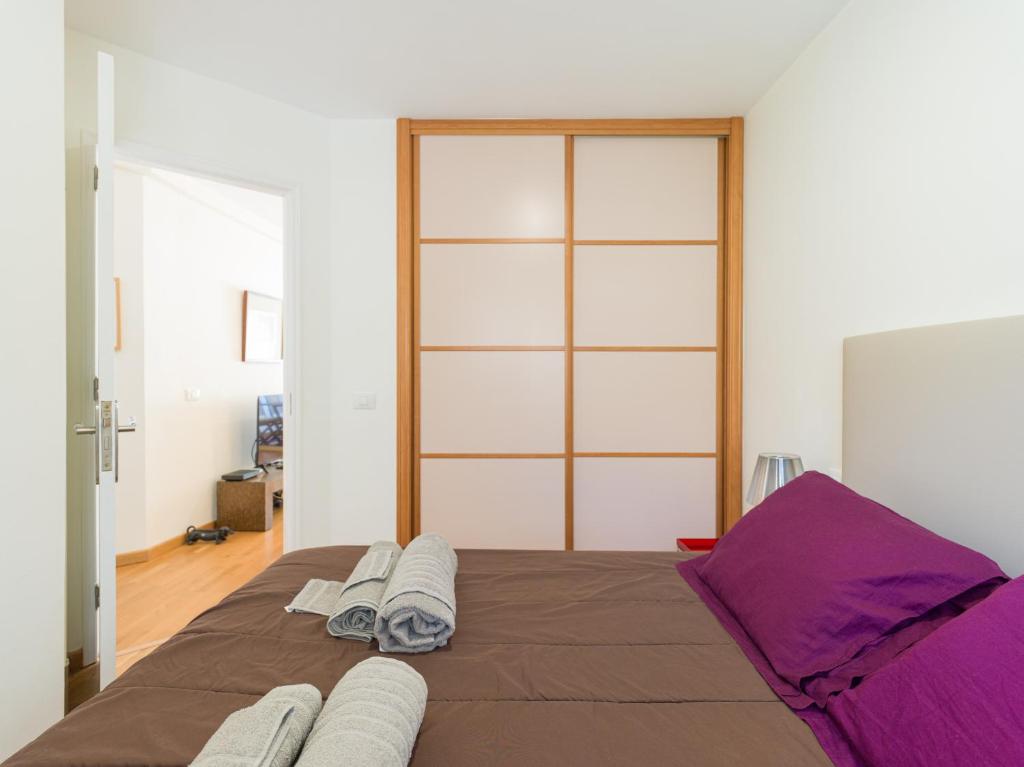A bed or beds in a room at Lovely Peaceful Home By CanariasGetaway