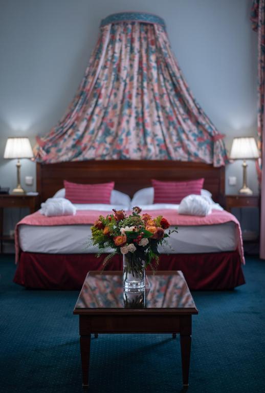 Postel nebo postele na pokoji v ubytování Hotel Liberty