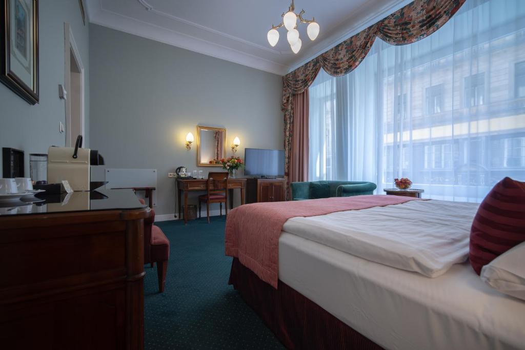 Postel nebo postele na pokoji v ubytování Hotel Liberty
