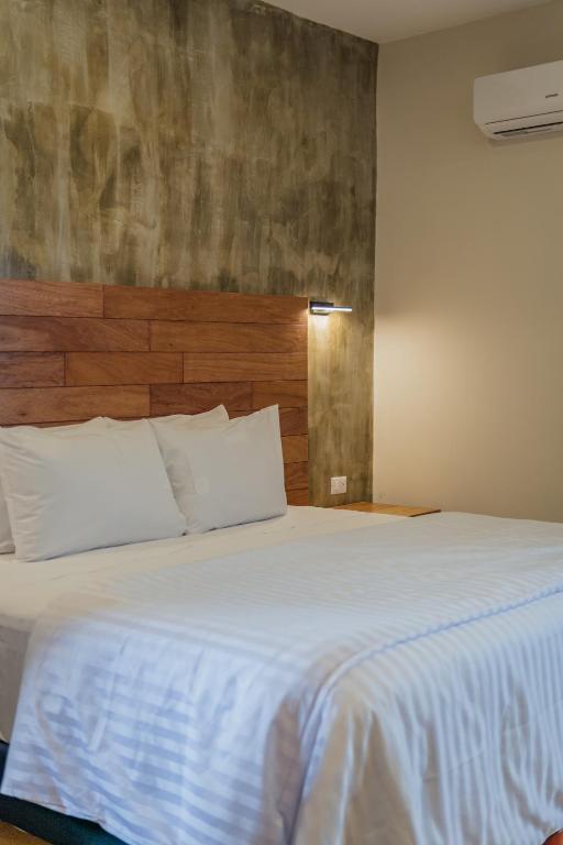 Postel nebo postele na pokoji v ubytování Hotel Casa 57