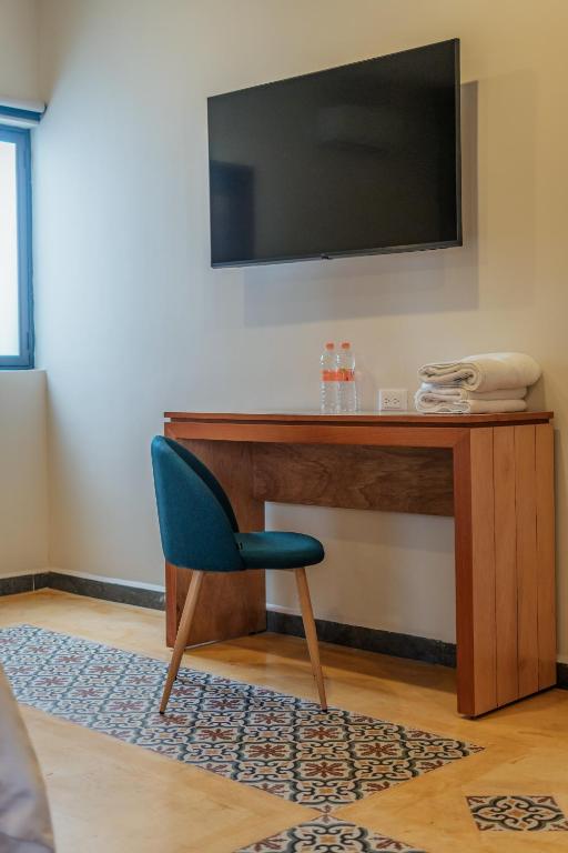TV a/nebo společenská místnost v ubytování Hotel Casa 57