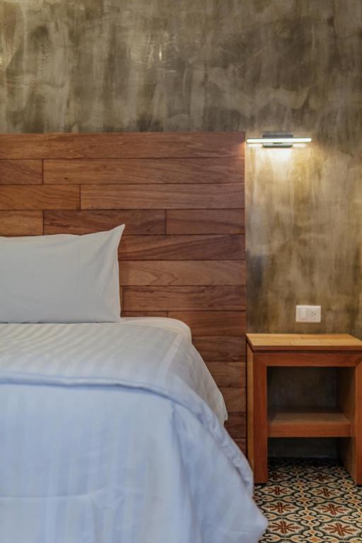 Postel nebo postele na pokoji v ubytování Hotel Casa 57