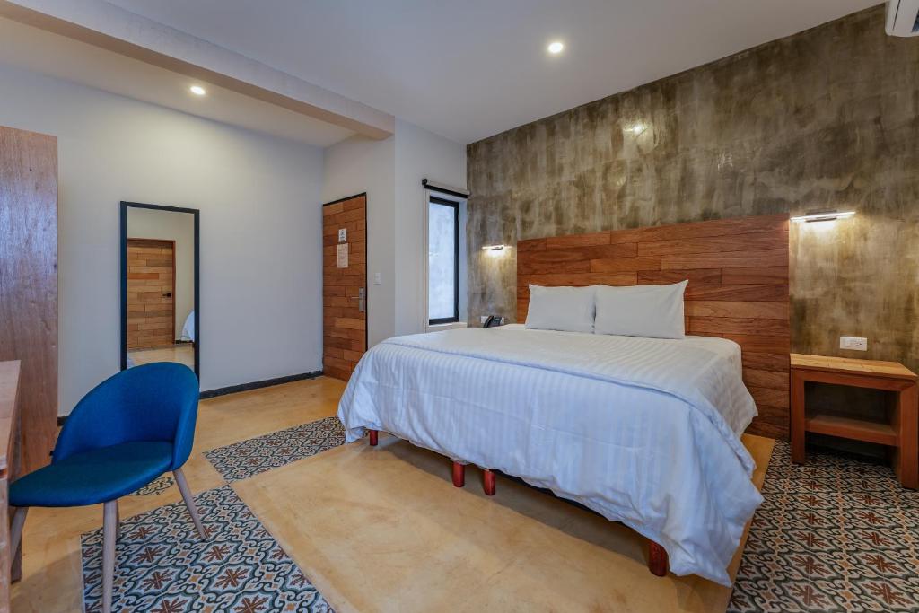 Postel nebo postele na pokoji v ubytování Hotel Casa 57