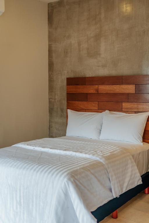 Postel nebo postele na pokoji v ubytování Hotel Casa 57