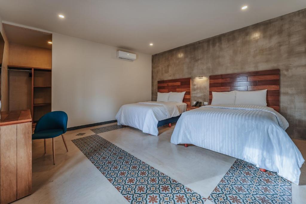 Postel nebo postele na pokoji v ubytování Hotel Casa 57