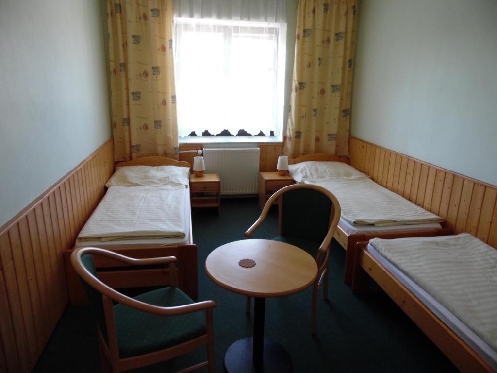 Postel nebo postele na pokoji v ubytování Penzion Velke Darko