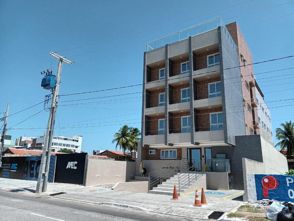 a building on the side of a street at Paradise Beach Flat in João Pessoa
