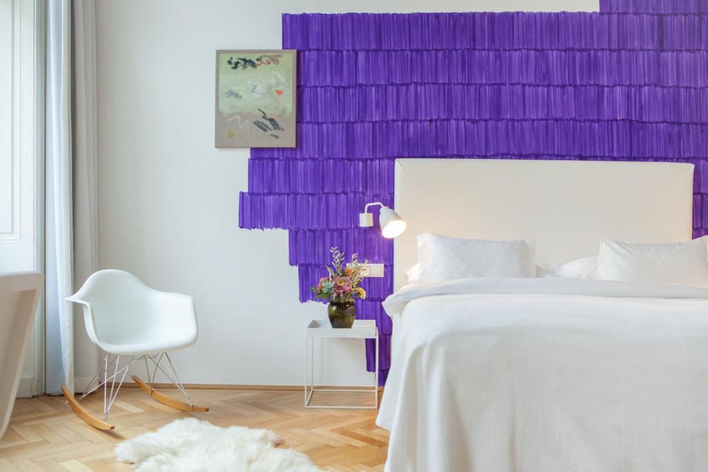 Postel nebo postele na pokoji v ubytování Small Luxury Hotel Altstadt Vienna