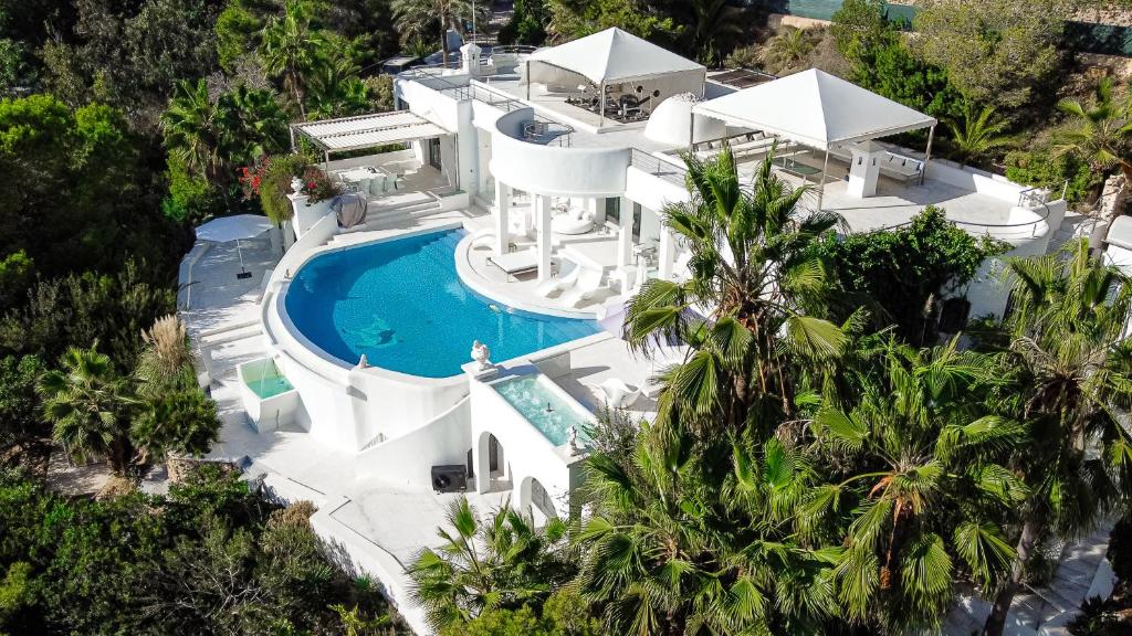 an aerial view of a house with a swimming pool at Villa Rica Beach in Ibiza Town