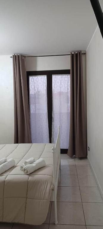 Postel nebo postele na pokoji v ubytování B&B Da Rocco