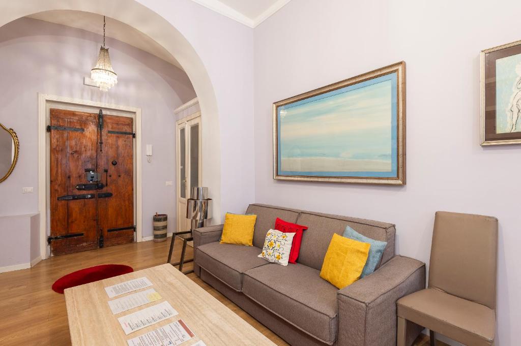 a living room with a couch and a table at Luxury Three Bedrooms flat in Roma Center in Rome