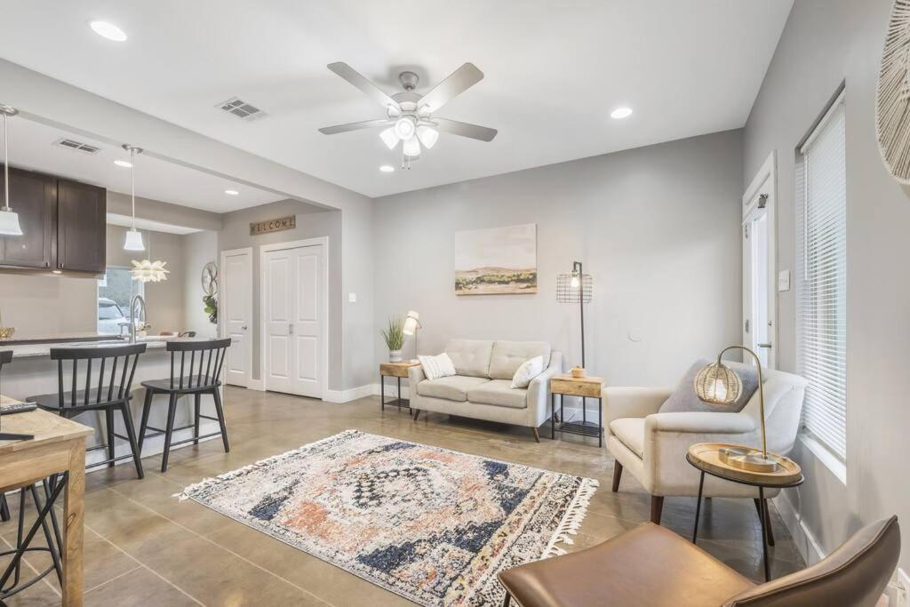 a living room with a couch and a table at Cozy 2 Bed Townhome near the Hospital in Lafayette