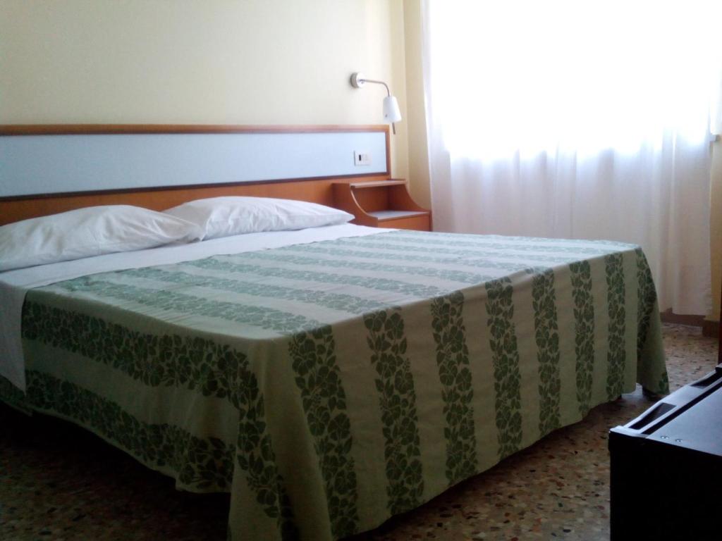 Postel nebo postele na pokoji v ubytování Hotel Sette Note