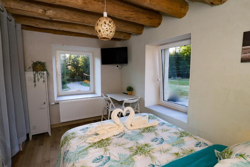 Postel nebo postele na pokoji v ubytování L'Hôtel Enfoncé, chambres d'hôtes