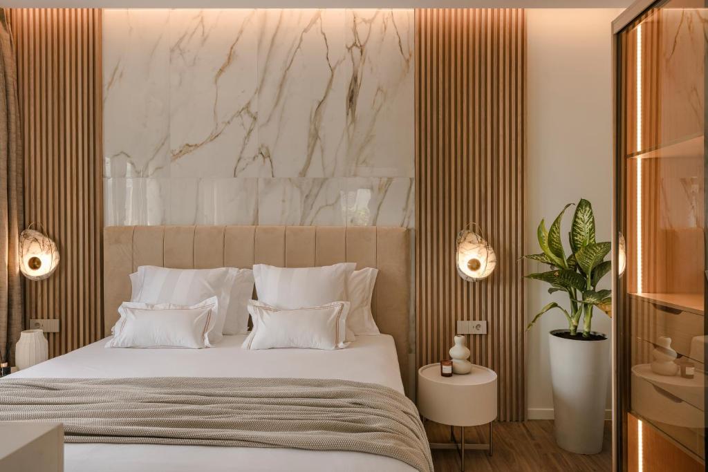 Postel nebo postele na pokoji v ubytování PIAZZA SUITES