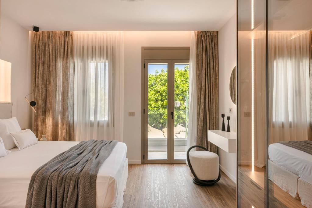 Postel nebo postele na pokoji v ubytování PIAZZA SUITES