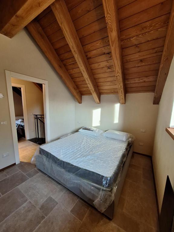 Postelja oz. postelje v sobi nastanitve Baita Croh - Villaggio dei Crodini