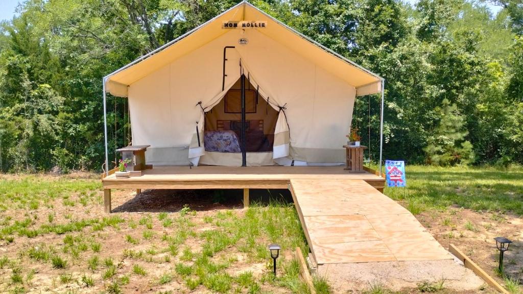 a tent in the middle of a field at Khushatta Hills Ranch Glamping - Mom Mollie in Coldspring