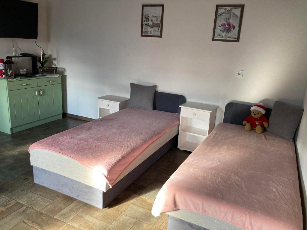 Postel nebo postele na pokoji v ubytování Hauptman apartman