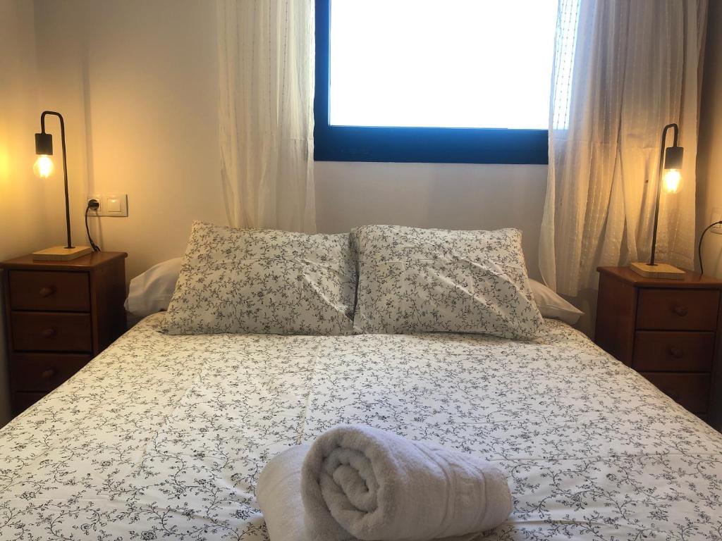 Postel nebo postele na pokoji v ubytování zona media apartamento confort monte oiz